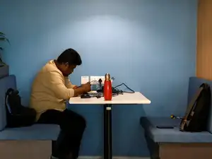 India's unemployment rate stays steady at 5% in September (An employee of Indian IT services exporter LTIMindtree works on his laptop inside its office in Bengaluru)