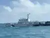 China sends naval forces to monitor US warship near disputed shoal