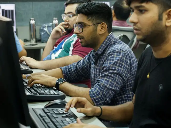 A broker reacts as he trades at his computer terminal inside a stock brokerage firm in Mumbai, India, July 23, 2024.