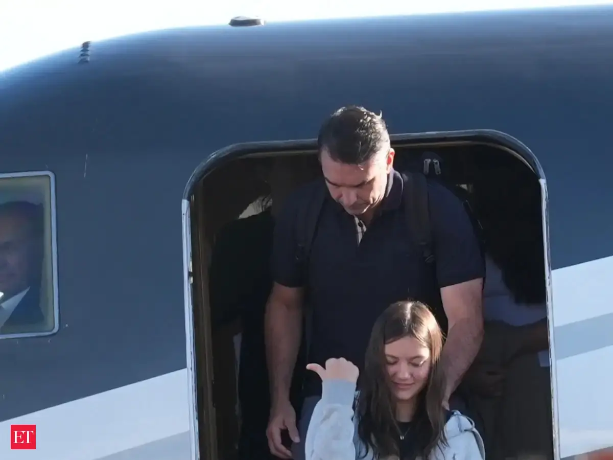 Defeated presidential candidate Flavio Bolsonaro and his family land in Miami after fleeing Brazil