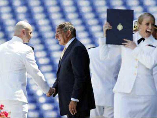 Leon Panetta shakes hands with a United States Naval Academy Midshipmen