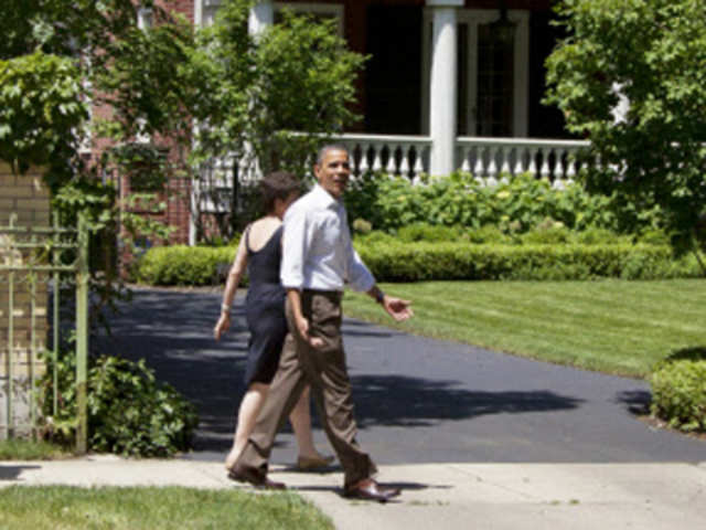 President Barack Obama walks through his Hyde Park neighborhood