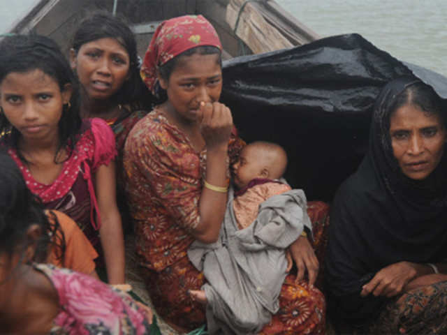 Rohingya refugees trying to cross the Naf river into Bangladesh to escape sectarian violence in Myanmar