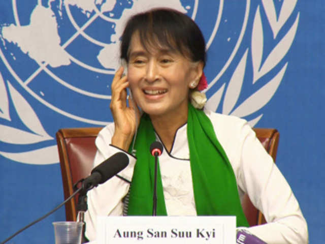Aung San Suu Kyi speaks at a news conference during the annual meeting of the ILO