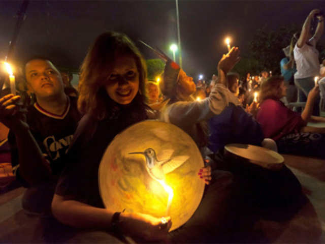 People stage a vigil for the environment during the People's Summit at Rio+20