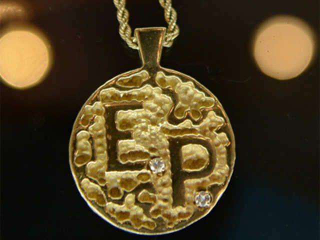 Elvis Presley's diamond-accented 14k gold medallion