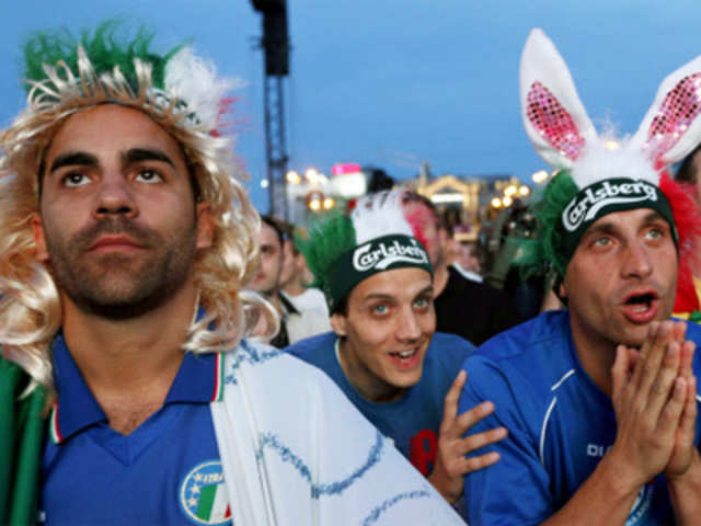 Italian soccer fans react while watching the Euro 2012 soccer championship quarterfinal match