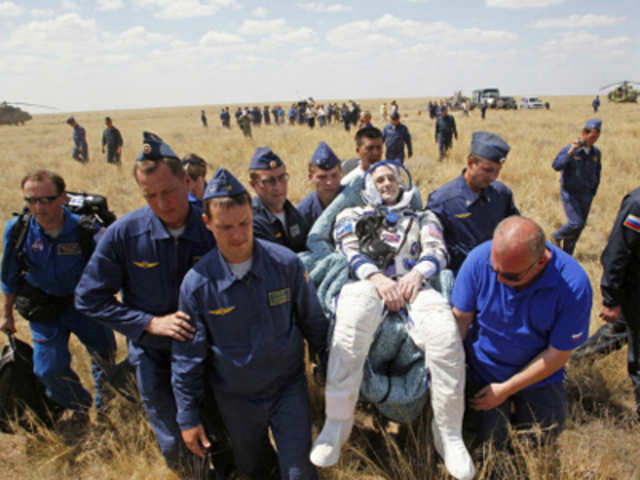 Russian space agency rescue team carry US astronaut Donald Pettit