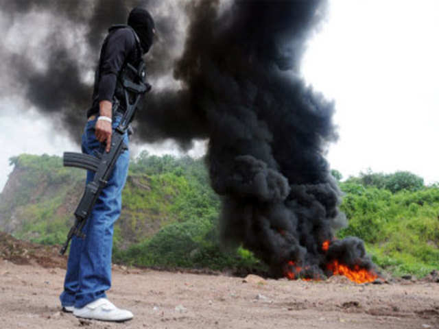 Burning packages containing cocaine, in Honduras