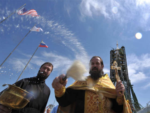 A Russian Orthodox priest blesses the Soyuz TMA-05M spacecraft