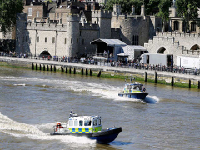 Police boats patrol on the River Thames