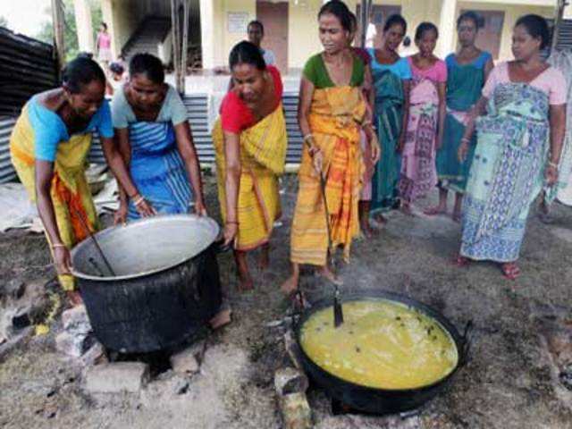 Bodo women prepare food at a relief camp