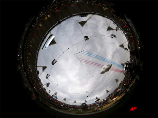 Red Arrows perform a fly past over the Olympic Stadium