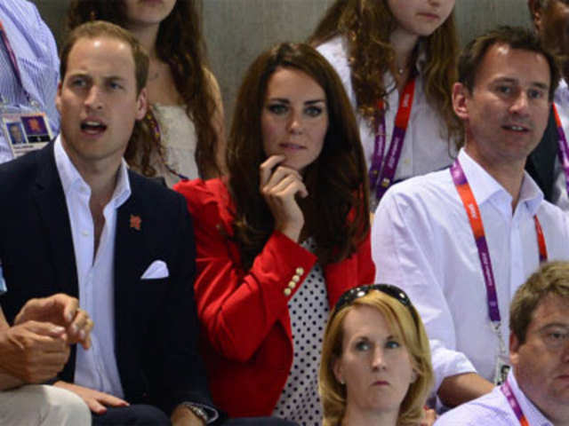 Britain's Prince William, Catherine, Duchess of Cambridge attend a swimming competition 