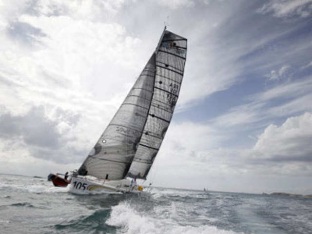 French skipper Sebastien Rogues and his teammates Remi Beauvais and Bertrand Castelnerac sail on their monohull 