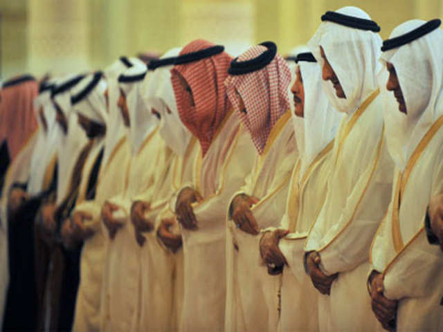 Members of the Saudi royal family offer their prayers