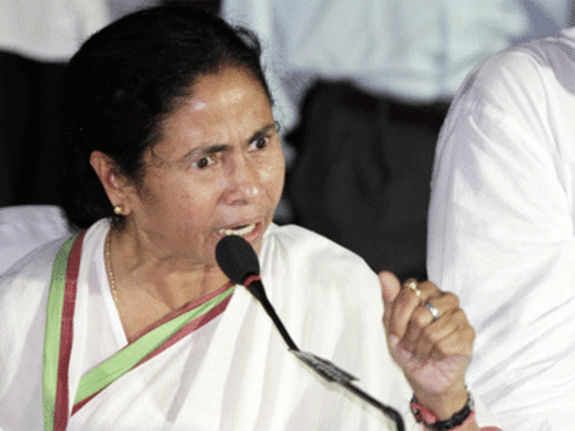 Trinamool Congress party leader Mamata Banerjee gestures during a press conference