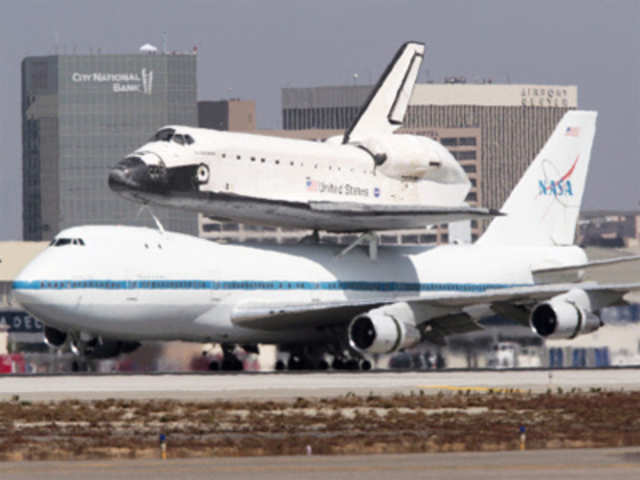 The Space Shuttle Endeavour arrives on the back of a 747 as it touches down at Los Angeles International Airport