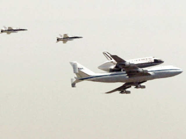 The Space Shuttle Endeavour on the back of a 747, followed by chase planes