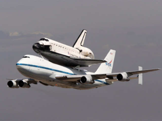 The Space Shuttle Endeavour does a flyby as it arrives on the back of a 747 en route to Los Angeles International Airport