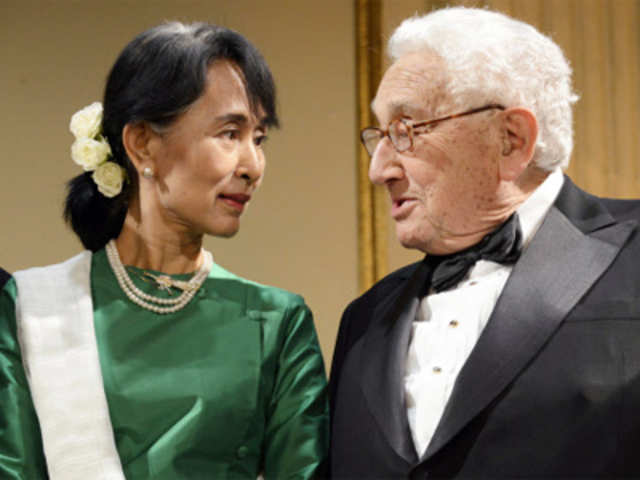 Myanmar's Aung San Suu Kyi speaks with US Secretary of State Henry Kissinger