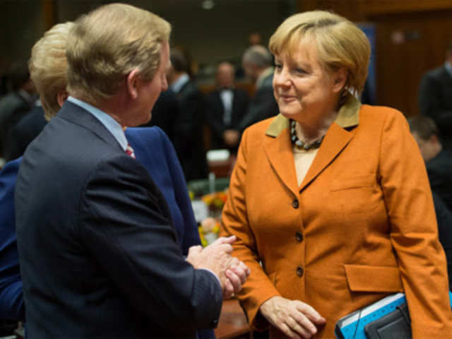 German Chancellor Angela Merkel speaks with Irish Prime Minister Enda Kenny