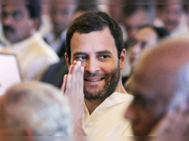 Rahul Gandhi greets a person at swearing-in ceremony for new ministers