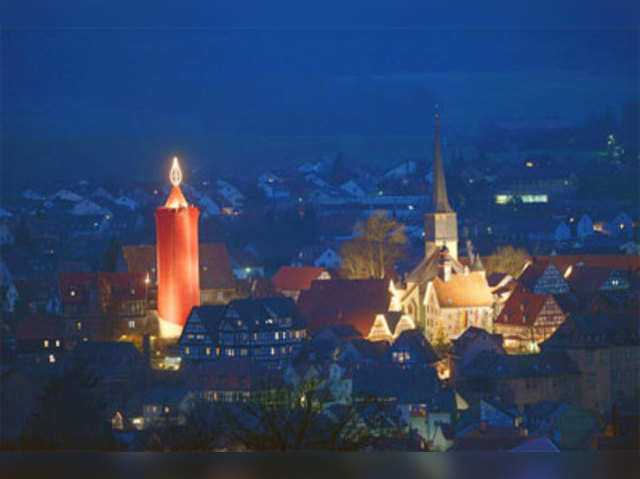 A large christmas candle is illuminated in Schlitz, Germany