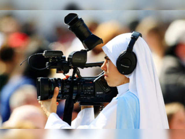A nun films Pope Benedict XVI