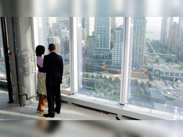 Michelle and Barack Obama look down at the 9/11 Memorial