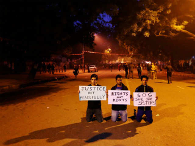 Demonstrators hold placards during a protest