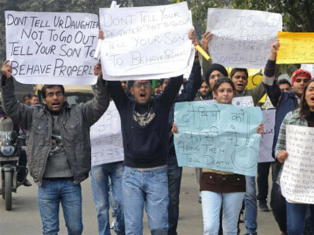 Indian activists hold placards as they protest against the gang rape