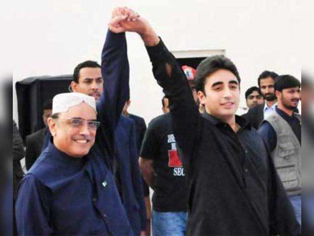 Asif Ali Zardari raises hand of his son Bilawal Bhutto