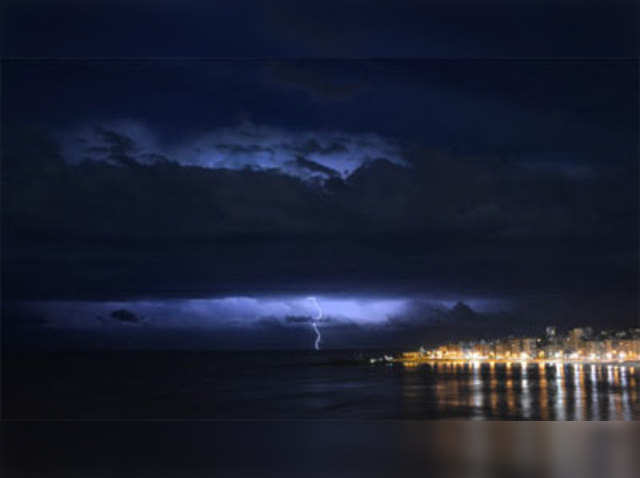 A lightning bolt flashes on the horizon over River Plate