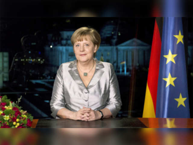 Angela Merkel poses for photographs after annual New Year's speech