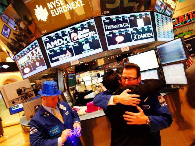 Trader hug on the floor of the New York Stock Exchange
