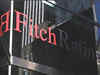 RBI, govt trying to manage rupee & reviving growth: Fitch