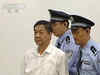 Bo Xilai distances from wife over bribery allegations