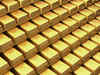 Gold swings as investors weigh stimulus outlook against budget