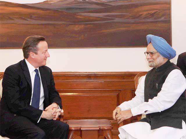 Manmohan Singh interacts with David Cameron