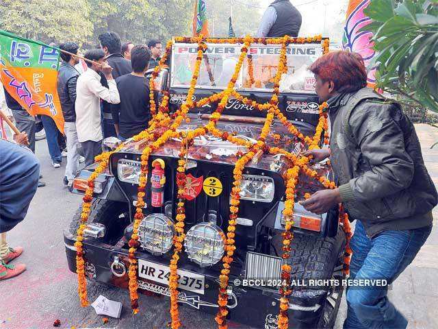 BJP supporters decorate an open jeep