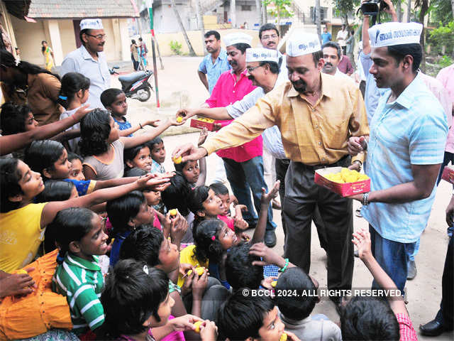 AAP representatives distribute sweets