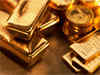 Gold dips below $1,200 as Fed trims stimulus