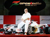 Mallya posing with Force India F1 car