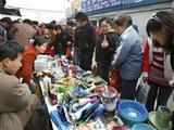 Shoppers buy goods at Beijing market