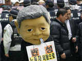 Protester wearing mask of Samsung Chairman