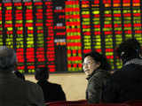 Chinese investors look at stock prices