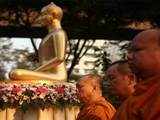 Buddhist monks offer prayer at a memorial ceremony