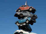 Towering sculpture of eight cars