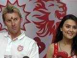 Preity  Zinta and Brett Lee at a news conference